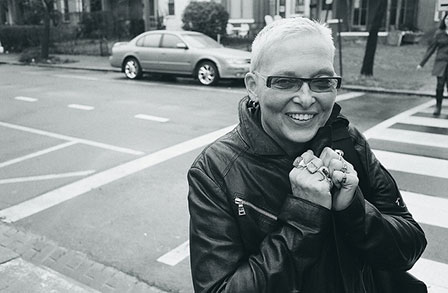 Black and white headshot of writer Jan Beatty in front of a crosswalk.